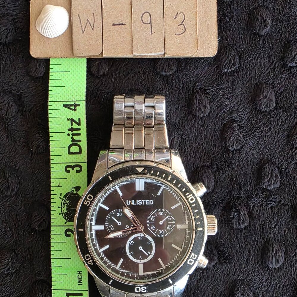 Item #W93 Unlisted black face 2 in round face 10in circumference Watch